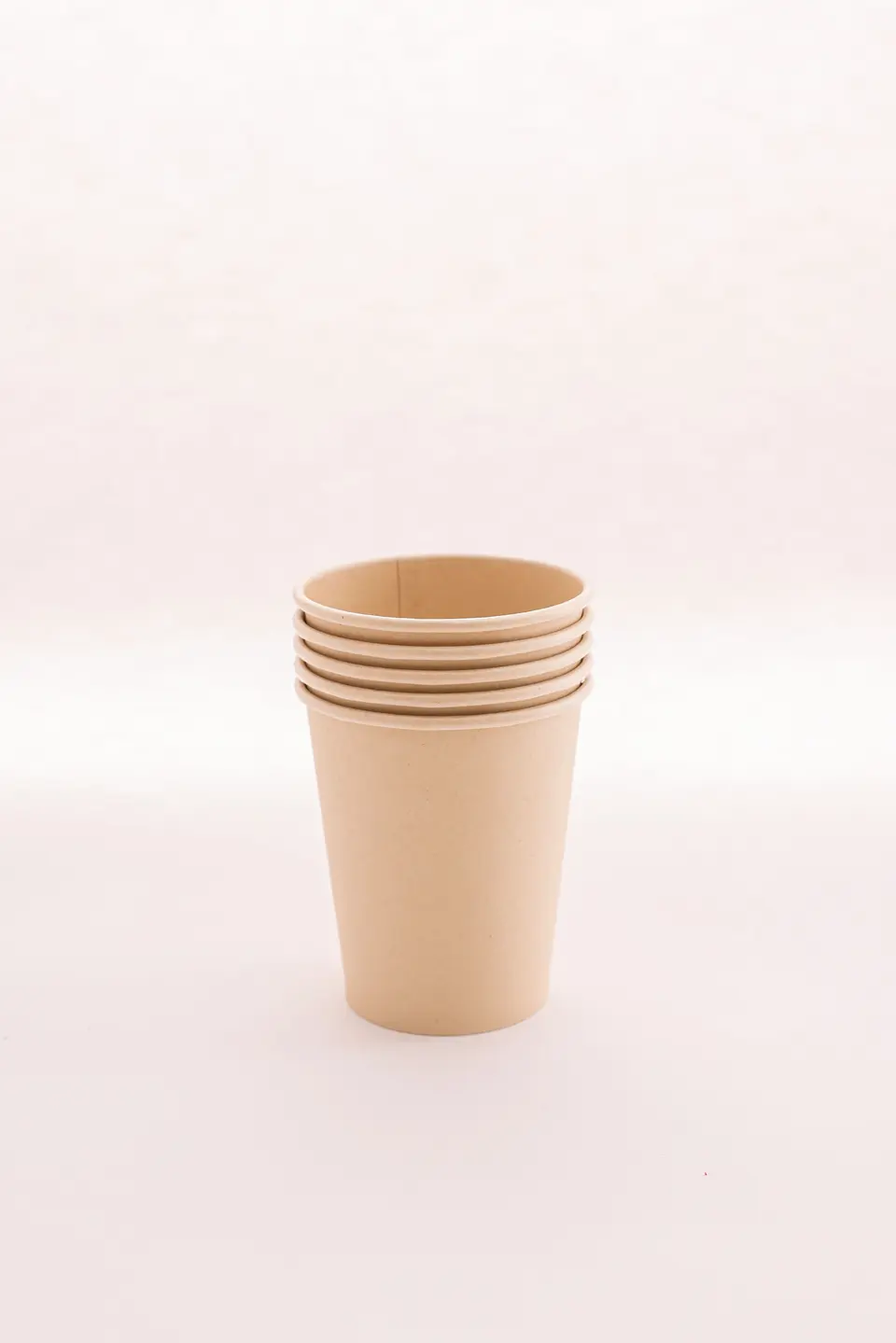 A short stack of plain kraft paper cups